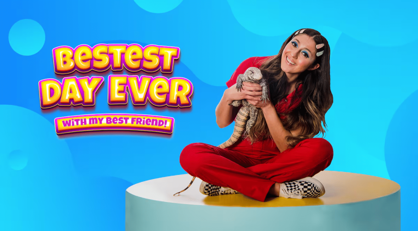 Person in a red jumpsuit holding a lizard against a bright blue background. Poster for children's show, Bestest Day Ever with My Best Friend.