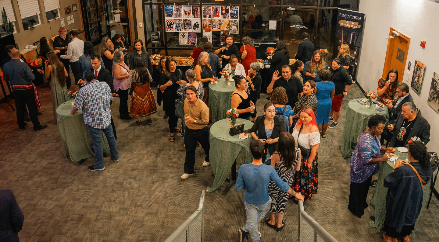Overhead crowd shot of attendees at the CBC New Indigenous Voices 20th anniversary celebration at Winnipeg's West End Cultural Centre.